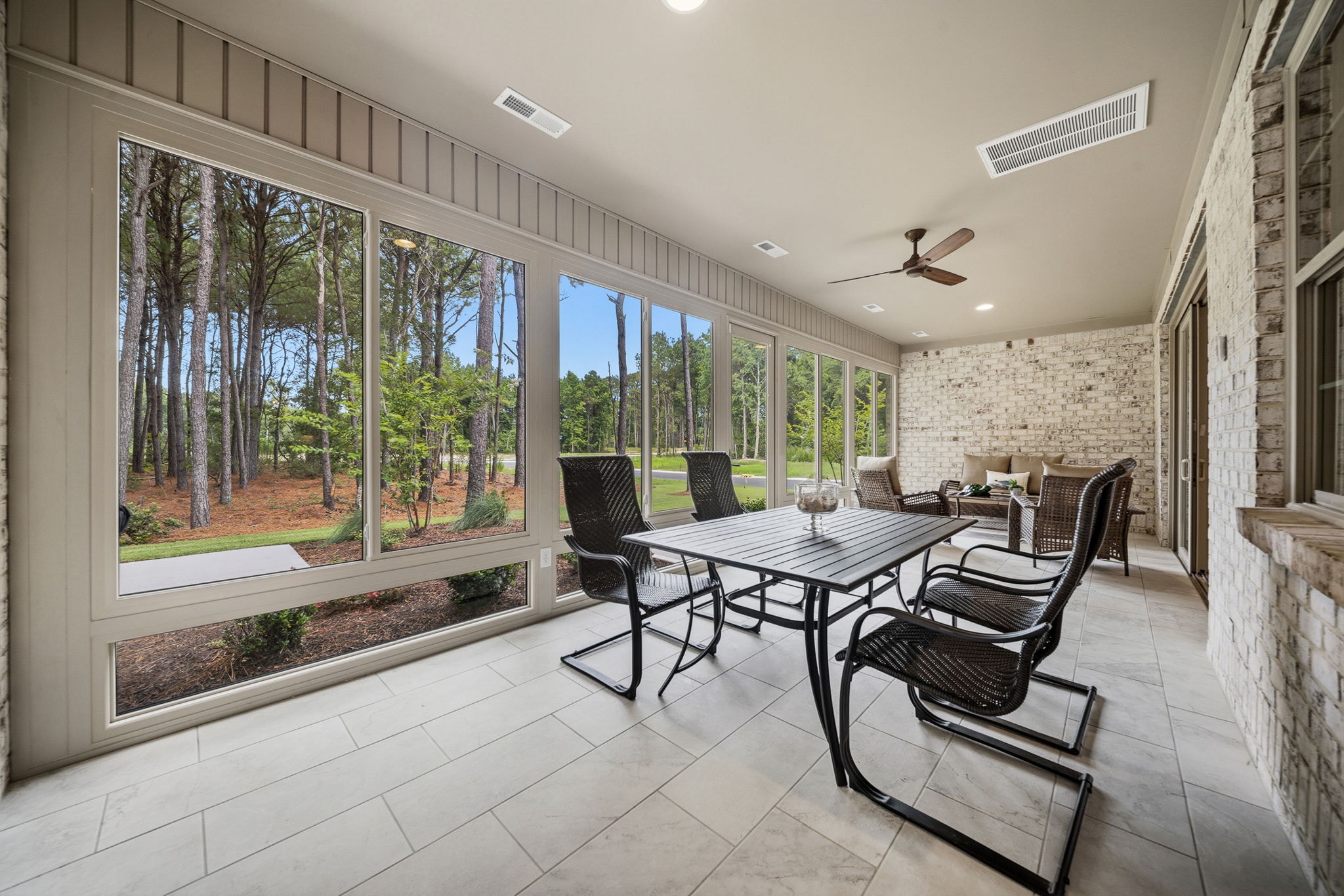 Pine Island sunroom with wooded views